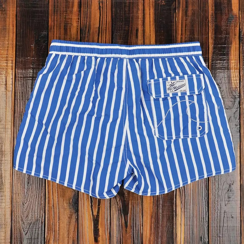 Bañador hombre corto rayas verticales azul y blanco - Oceanix
