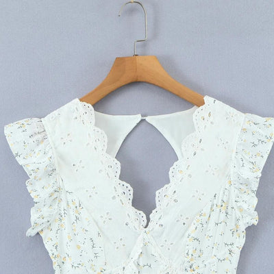 Lyra - Juguetón minivestido con bordado de ojales