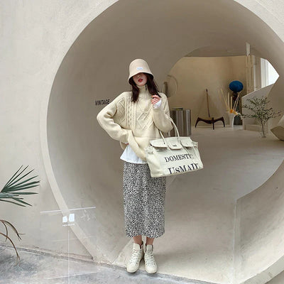 Hanna - Jersey de cuello alto con diseño geométrico de punto trenzado