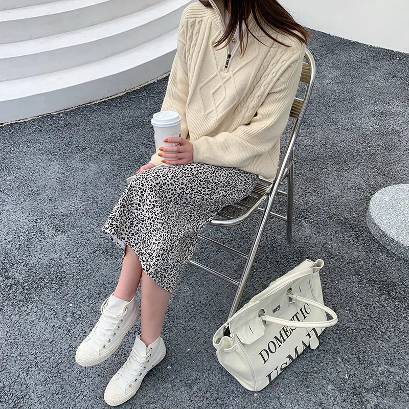 Hanna - Jersey de cuello alto con diseño geométrico de punto trenzado