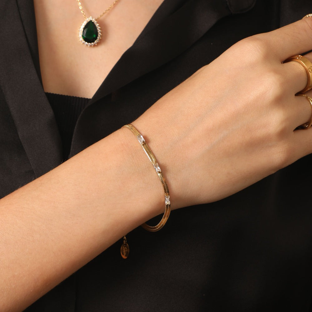 Pulsera Signature Sleek chapada en oro de 14 quilates