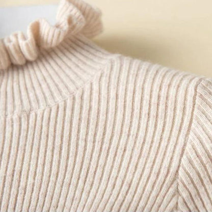 Lilia - Jersey de cuello alto de canalé con cuello de volantes