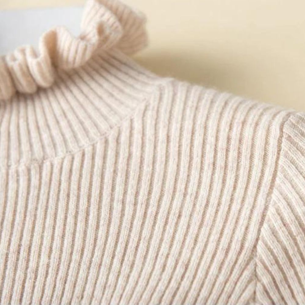 Lilia - Jersey de cuello alto de canalé con cuello de volantes