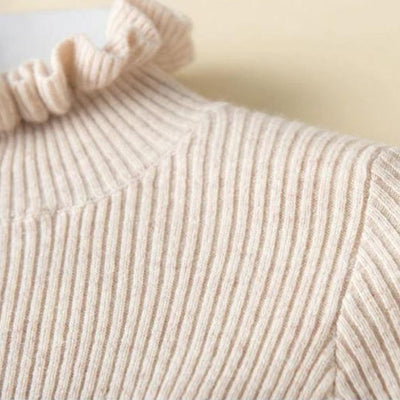 Lilia - Jersey de cuello alto de canalé con cuello de volantes