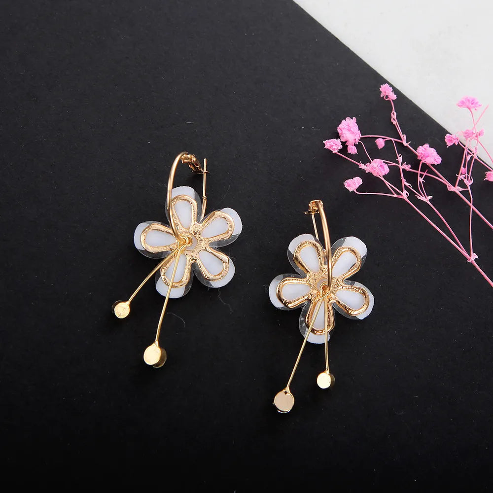 Pendientes flor lila