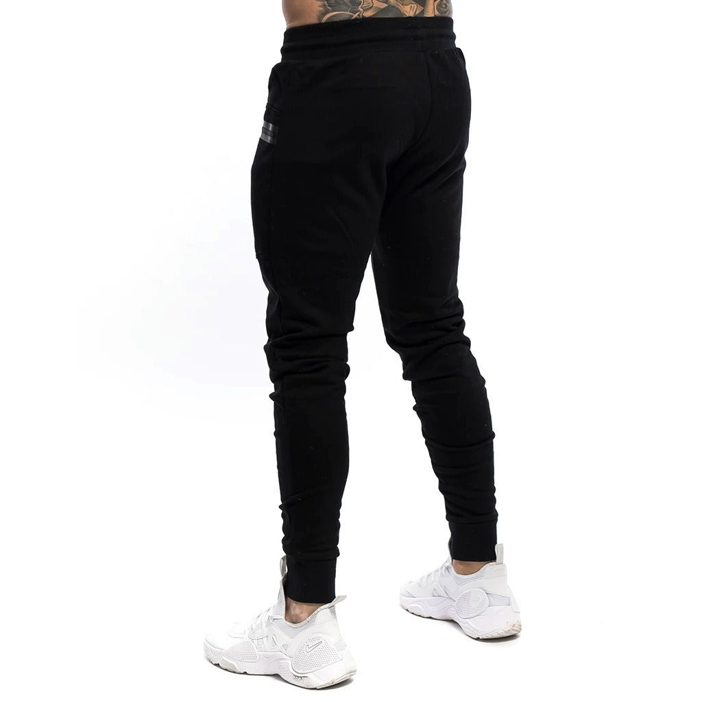 Pantalones deportivos para hombre tejido técnico estilo ajustado - Finn