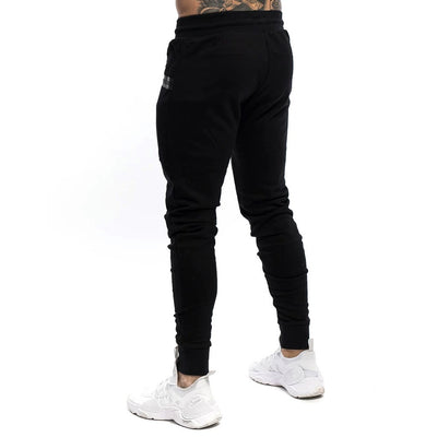 Pantalones deportivos para hombre tejido técnico estilo ajustado - Finn